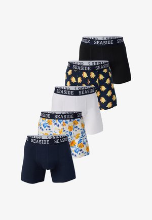 Vijf paar herenslips in zwart, marineblauw, wit, marineblauw met gele vissen en wit met blauwgele bloemmotieven.