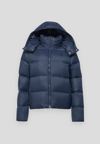 Veste d'hiver matelassée bleu marine avec capuche amovible, fermeture éclair frontale, col montant et petit logo "cK" sur la poitrine.