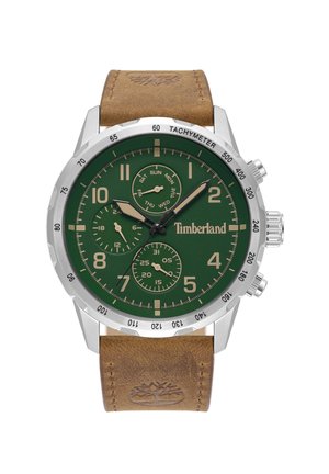 Vihreä kellotauluinen chronograph-kello, jossa on ruostumattomasta teräksestä valmistettu kuori, vaaleanruskea nahkaranneke, suuret numerot ja viikonpäivän indikaattorit.