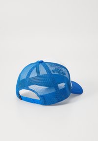 Blue and white trucker cap with a curved brim, mesh back, adjustable plastic snap closure, and a solid blue button on top.