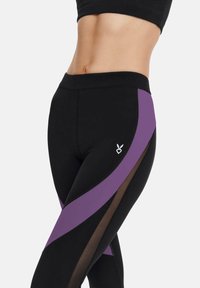 Black leggings with purple and brown side panels, featuring a mesh detail. The design includes a small white logo on the thigh.
