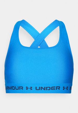Modrá športová podprsenka s krížovými popruhmi a širokým čiernym logom na spodnej časti. Vyrobená z hladkého, elastického materiálu.
