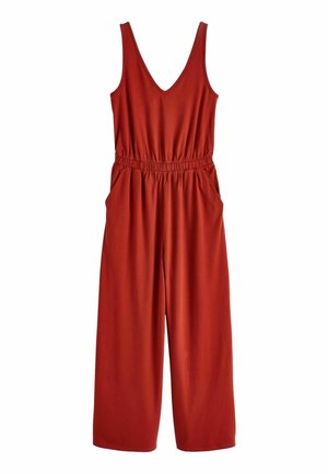 Combinaison sans manches couleur rouille avec col en V, taille élastique, poches latérales et pantalons à jambes larges.