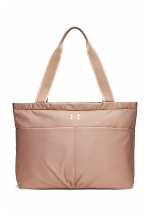 Beige Under Armour draagtas met brede schouderbanden en voorzakken, met het logo van het merk in het midden.