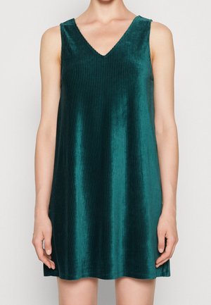 Robe sans manches en velours côtelé vert sarcelle avec un décolleté en V, une coupe décontractée et un ourlet qui tombe au-dessus du genou.