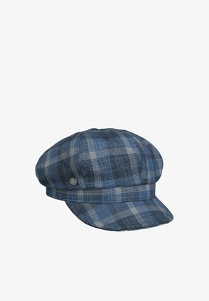 Blue and gray plaid flat cap with a short brim and a small round metal emblem on the side.