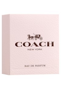 Coach Eau de Parfum-förpackning, rosa texturerat kort med präglad logotyp i mörkbrunt. Framtexten visar "COACH NEW YORK" och "EAU DE PARFUM."