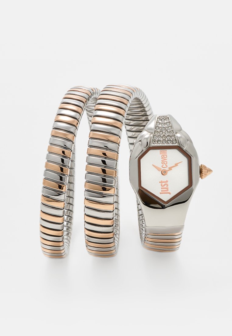 Silberne und roségoldfarbene Metalluhr mit einem sechseckigen Ziffernblatt, weißem Ziffernblatt und Kristallakzenten. Flexibles Armband im verknüpften Design.