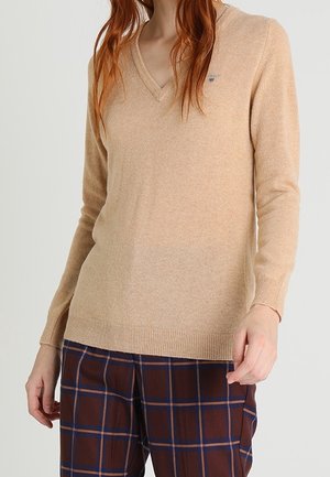 Stickad tröja - beige