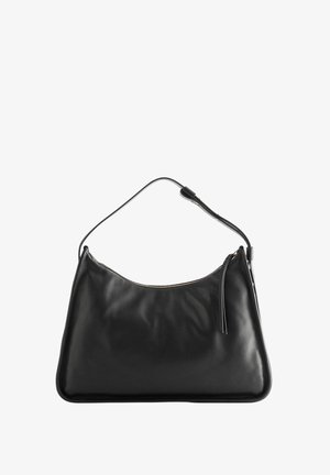 Black leather handbag with a curved silhouette, featuring a zip closure and a single strap. Smooth texture and subtle stitching detail.