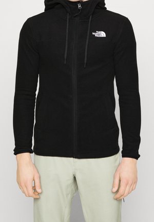 Czarna bluza z kapturem zapinana na zamek, wykonana z miękkiego materiału, z przednim zamkiem błyskawicznym, regulowanymi sznurkami i małym białym logo na lewej piersi.