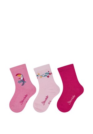 Drei Paar Baumwollsocken: ein Paar mit Tukan-Motiv, ein weiteres mit Blumenmustern auf Pink, und ein einfarbiges pinkes Paar.
