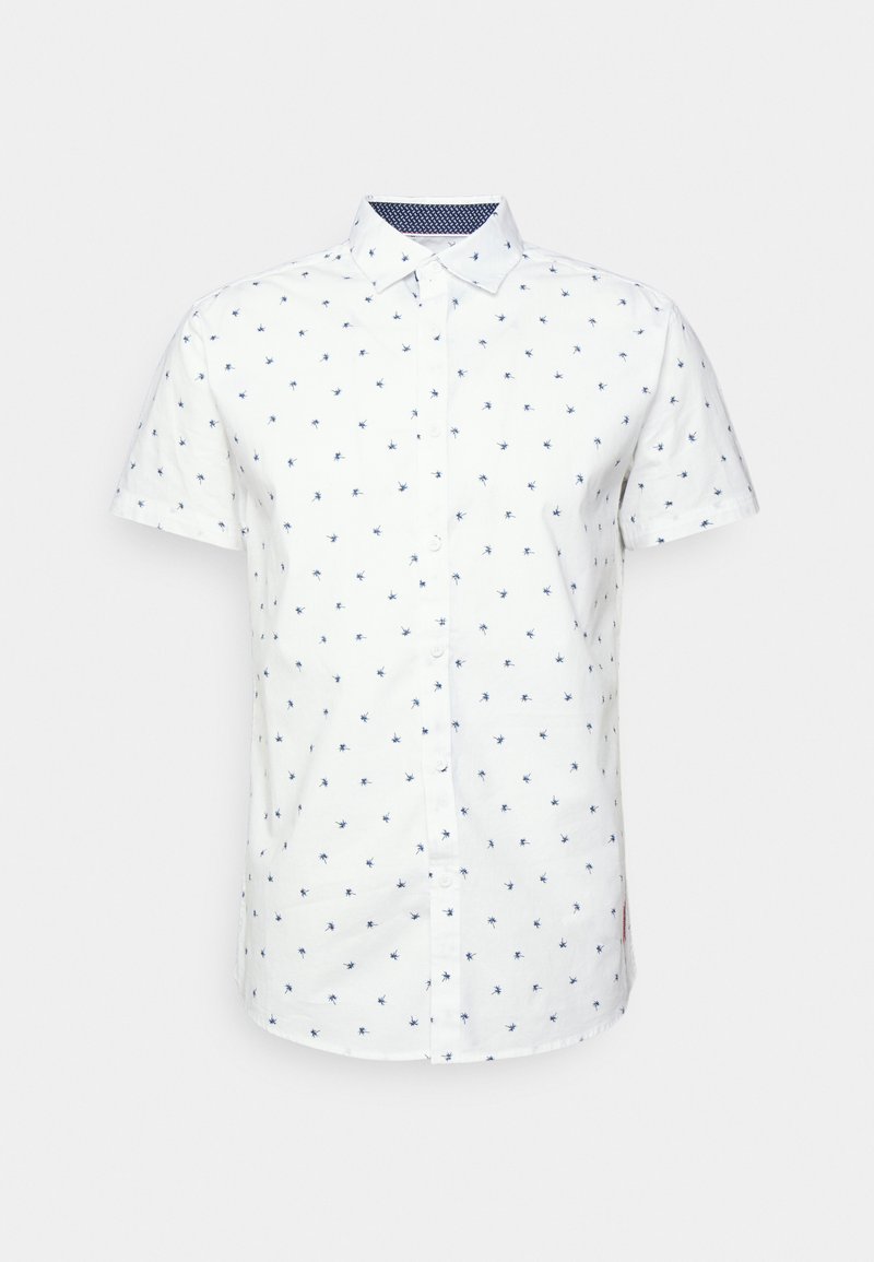Biała koszula z krótkim rękawem w granatowy wzór małych motywów kwiatowych. Zapięcie na guziki, kołnierzyk oraz kontrastowa granatowa podszewka.