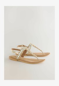 Sélectionné, new gold leather