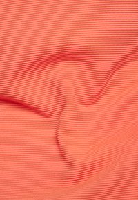Coral ribbed fabric with a smooth, textured surface. The material features horizontal lines creating a subtle pattern.