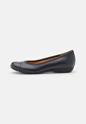 Navy blue leather ballet flat with a glossy toe cap, smooth texture, rounded design, and minimalistic style. Slim rubber sole for flexibility.