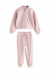 Roze sweat outfit met een cropped jack met rits en een ronde halslijn, voorzien van elastische manchetten, gecombineerd met bijpassende joggerbroeken met zakken.