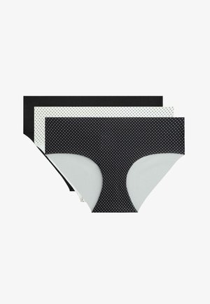 Trei chiloți hipster pentru femei în negru, alb și negru cu buline albe, așezați unul peste altul și întinși pe un fundal alb.