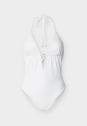 Λευκό ολόσωμο μαγιό με τιράντα halter, βαθύ V ντεκολτέ και ρυθμιζόμενους δεσίματα στον λαιμό και την πλάτη.