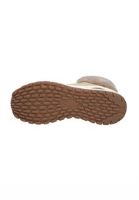 Suola di stivale invernale beige con battistrada in gomma marrone strutturato e colletto peloso visibile nella parte superiore.