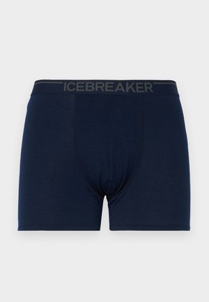 Boxer briefs en azul marino que cuentan con una tela suave, un ajuste ceñido y una cinturilla elástica con el logo "ICEBREAKER" en gris.