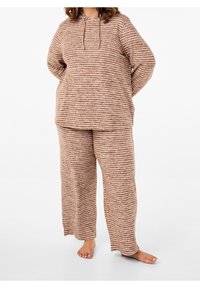 Brun- och krämrandig loungewear-set bestående av en huva-tröja och vida byxor. Mjuk tyg med en avslappnad passform och långa ärmar.