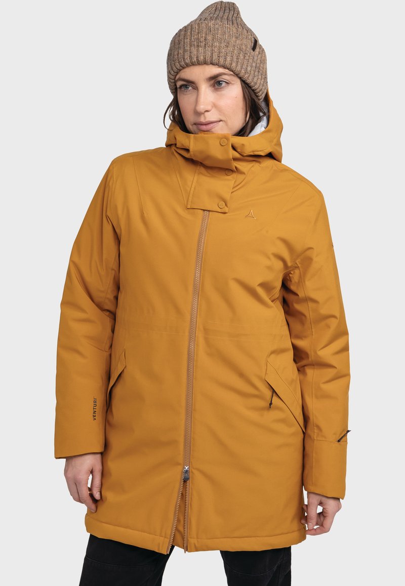 Mustard yellow insulated jacket with a high collar, adjustable hood, zip closure, and two side pockets; smooth texture with logo detail.