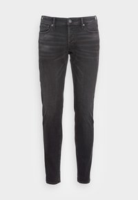 Svarta denimjeans med slim fit. Har en frontknäppning, femficksdesign och en subtil blekt mönster på tyget.