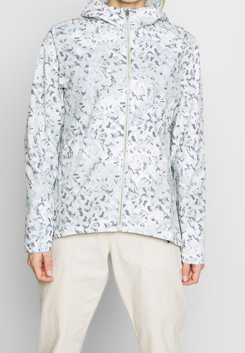 Blommönstrad lättviktsjacka i dämpade pasteller, med framsida dragkedja, huva och långa ärmar. Slät, vattenavvisande tyg.