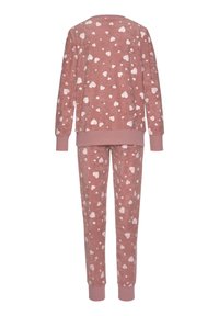 Pink pajama set featuring a brushed texture, long-sleeved top, and pants, adorned with small white heart patterns. Ribbed cuffs and hem.
