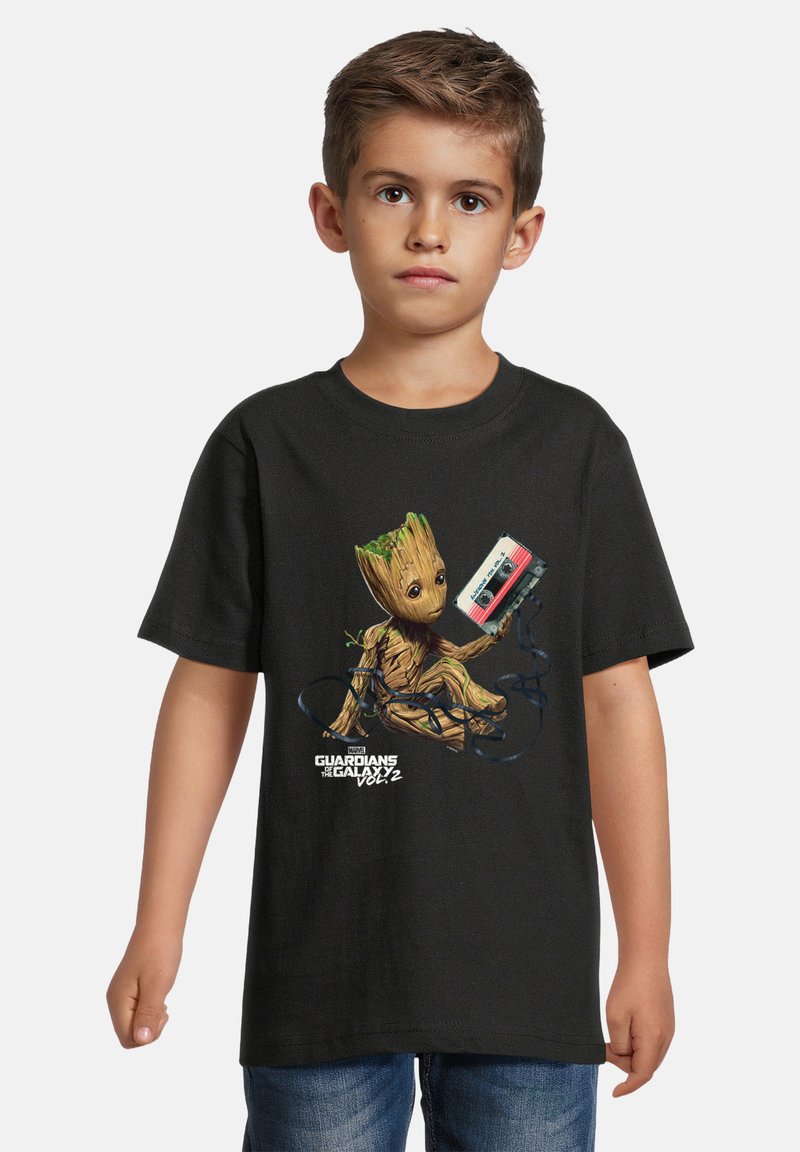 Black cotton t-shirt featuring a graphic of a cartoon character, Groot, holding a cassette tape, with vibrant green accents in his design.