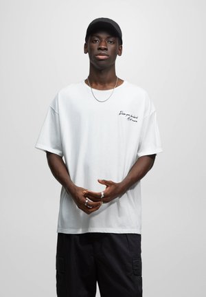SHORT SLEEVE WITH SLOGAN - T-shirt med print - off white