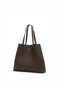 Brown leather tote bag with double handles, textured surface, spacious interior, and subtle branding on the front.