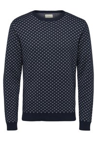 Marinblå crewneck-tröja med ett vitt mönster av små snöflingor, ribbade ärmar och nederkant, långa ärmar.