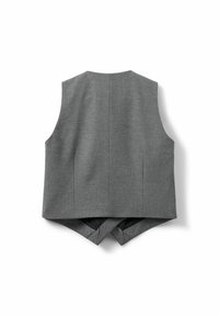 Gray sleeveless vest featuring a structured design with a smooth texture, open back, and tailored seams. Notable crossover detail at the hem.