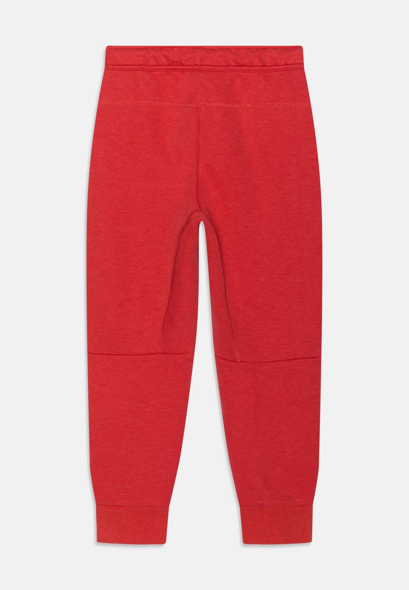 Rote Jogginghose mit weichem Stoff, elastischem Bund, schmal zulaufenden Beinen und Kniepaneelen. Schlichte Design ohne zusätzliche Verzierungen.