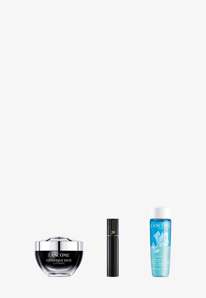 Crème pour les yeux Lancôme Génifique Yeux, mascara Hypnôse, et flacon de démaquillant pour les yeux Bi-Facil sur fond blanc.