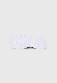 White athletic shoe sole with textured grip pattern and rounded edges. Features a slight curve and a smooth finish.