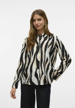 Langarmshirt met een zwart en beige zebra-strepenpatroon, met kraagontwerp, knoopsluiting aan de voorkant en een relaxte pasvorm. Zachte stoftextuur.