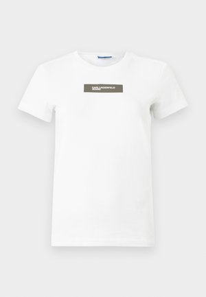 White cotton t-shirt with short sleeves, crew neck, and a rectangular olive green label featuring "KARL LAGERFELD JEANS" in white text.