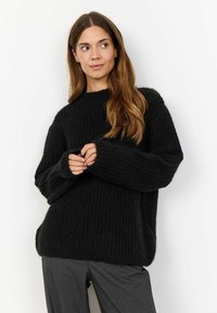 Maglione nero a coste con una vestibilità comoda, scollatura rotonda e maniche lunghe e morbide. Realizzato in filato spesso con una consistenza morbida.