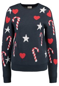 Marinblå tröja med stickade polkagrisar, röda hjärtan och vita stjärnor. Rund halsringning, långa ärmar, ribbad nederkant och ärmslut.
