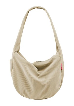 Beige Cord-Taschen mit breitem Riemen und Reißverschluss, mit einem kleinen roten Markenlabel an der Seite.