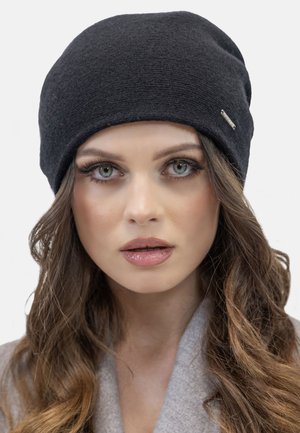 Black knit beanie with a soft texture, rounded shape, and a subtle logo accent. Features a snug fit and a smooth finish.