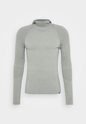 Light gray long-sleeve top with a fitted design, textured fabric, high collar, and contrast-knit accents at shoulders and elbows.