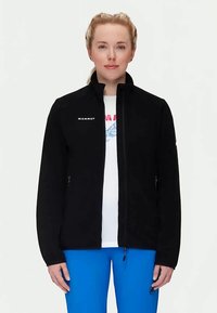 Must musta jope kõrge kraega, lukuga esipaneel ja küljetaskud. Vasakul rinnal on valge "Mammut" logo ning jope on sileda tekstuuriga.