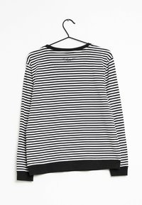 Camisa de manga larga a rayas blanco y negro con cuello redondo, puños acanalados y dobladillo. El material parece suave con una textura lisa.
