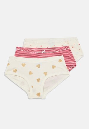 Set aus drei Baumwollslips für Mädchen in Weiß mit goldenen Herzen, rot-weißen Streifen und Weiß mit kleinen festlichen Drucken.