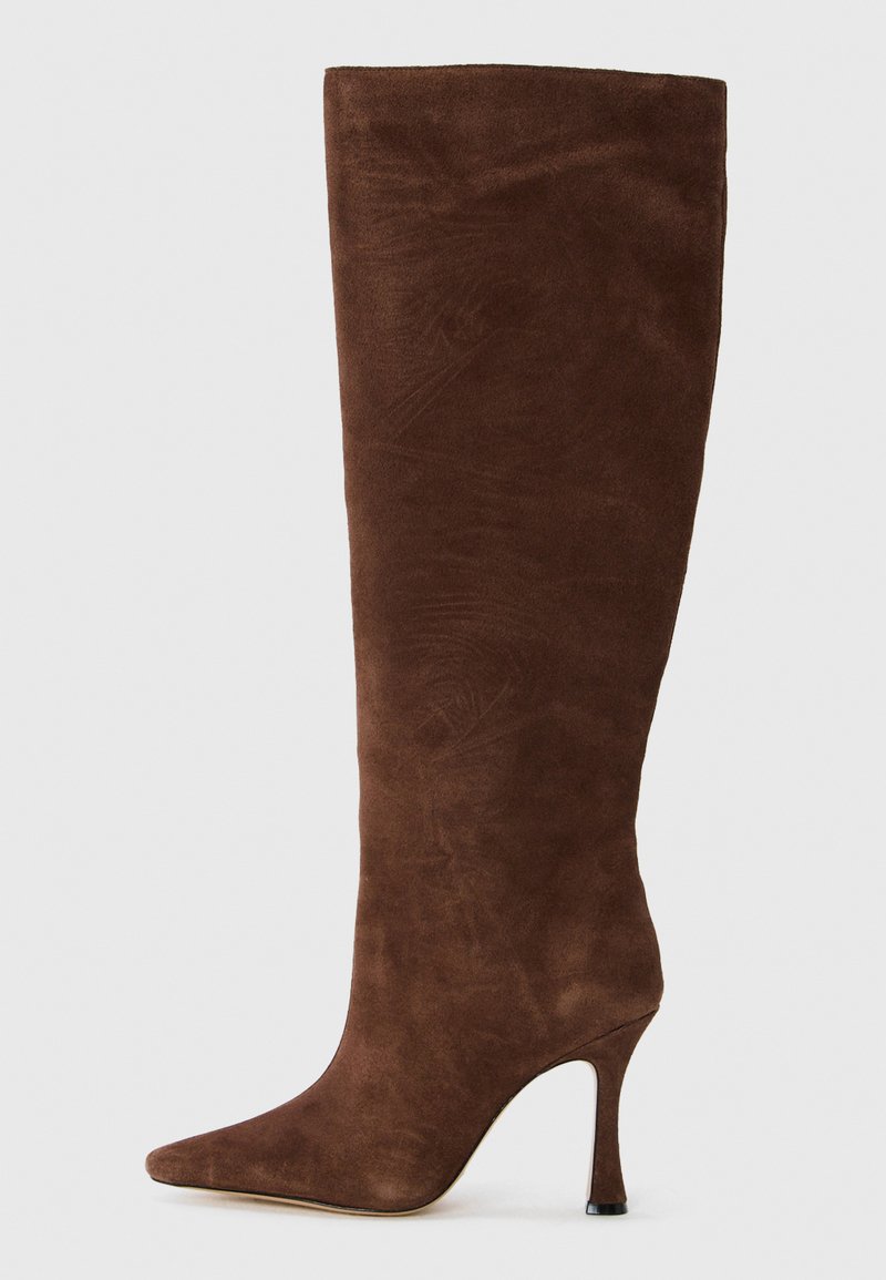 Brown suede knee-high boot with a pointed toe and slim stiletto heel. Soft texture and smooth finish, without visible hardware or accents.