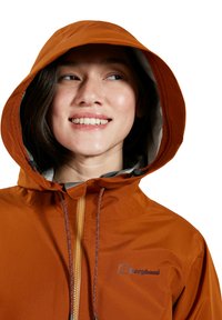 Orange waterproof jacket with a zip front, adjustable hood, and drawstrings. Features a logo on the left chest and a smooth texture.
